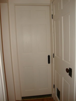 Bathroom to the left, Den/Office ahead, Basement to the right. I rehung that door with new hinges and reset the surface mount lock. This is all in Behr's Clay Dust (N250-1) Premium Plus Eggshell finish